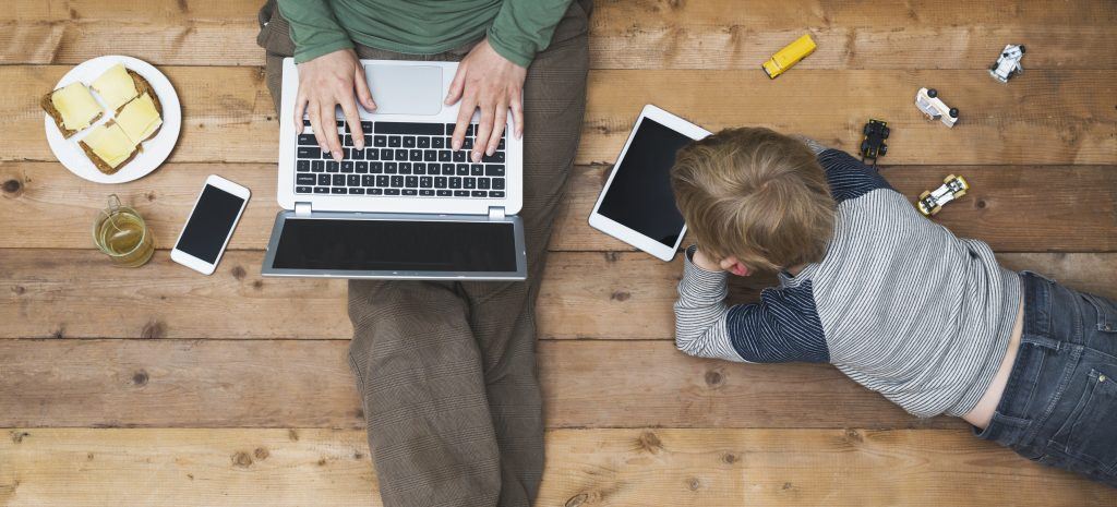 Mother and son using tablet and laptop 5 Apps for Divorced Parents
