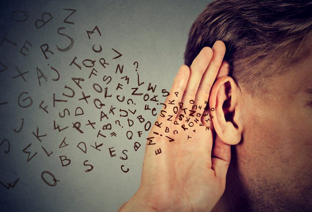 man holds his hand near ear and listens carefully alphabet letters flying Communication is Key (Part 2)